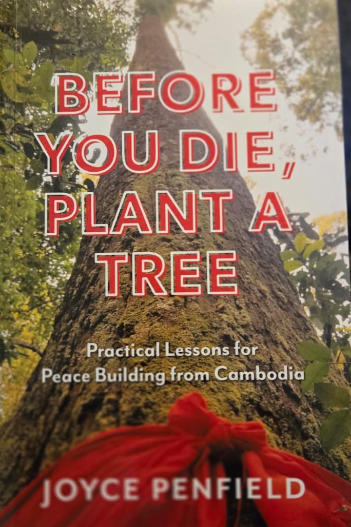 Cover of Before You Die, Plant a Tree by Joyce Penfield, showing a tall tree with a red cloth tied around its trunk